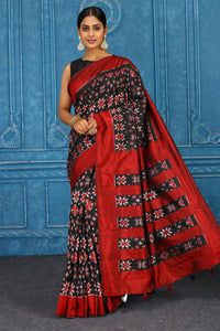 Buy black pochampally silk ikkat sari online in USA with red border. Look your best on festive occasions in latest designer sarees, pure silk sarees, Kanchipuram sarees, handwoven sarees, tussar silk sarees, embroidered sarees from Pure Elegance Indian clothing store in USA.-full view