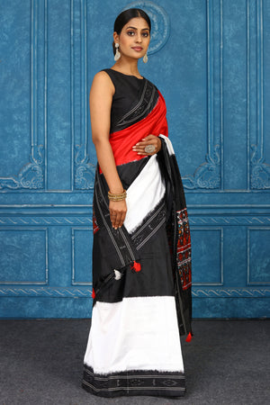 Shop black, white and red pochampally silk ikkat sari online in USA. Look your best on festive occasions in latest designer sarees, pure silk sarees, Kanchipuram sarees, handwoven sarees, tussar silk sarees, embroidered sarees from Pure Elegance Indian clothing store in USA.-side