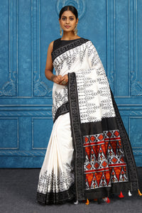 Buy off-white pochampally silk ikkat sari online in USA with black border. Look your best on festive occasions in latest designer sarees, pure silk sarees, Kanchipuram sarees, handwoven sarees, tussar silk sarees, embroidered sarees from Pure Elegance Indian clothing store in USA.-full view