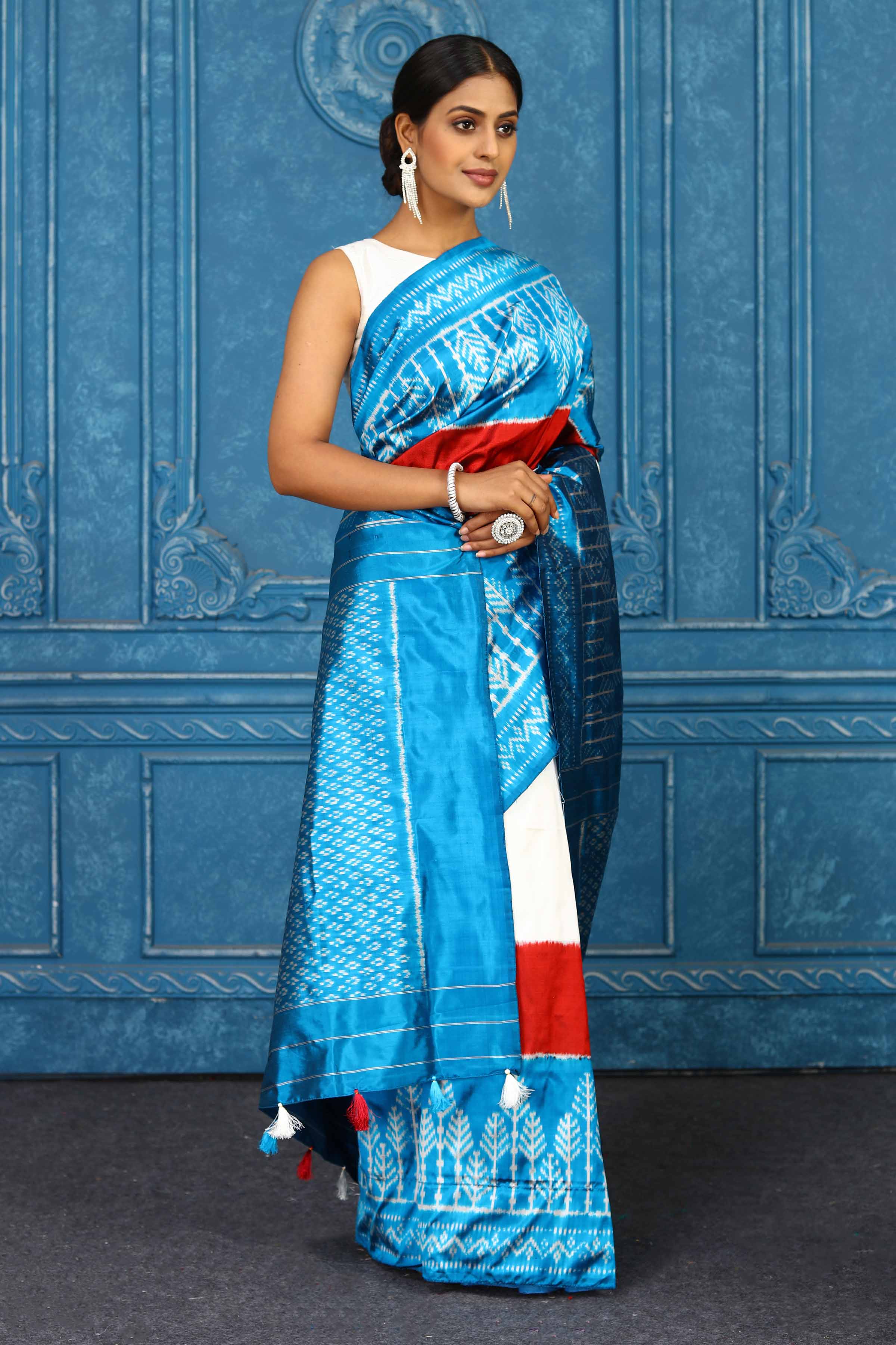 Buy cream and turquoise blue pochampally silk ikkat sari online in USA. Look your best on festive occasions in latest designer sarees, pure silk sarees, Kanchipuram sarees, handwoven sarees, tussar silk sarees, embroidered sarees from Pure Elegance Indian clothing store in USA.-side