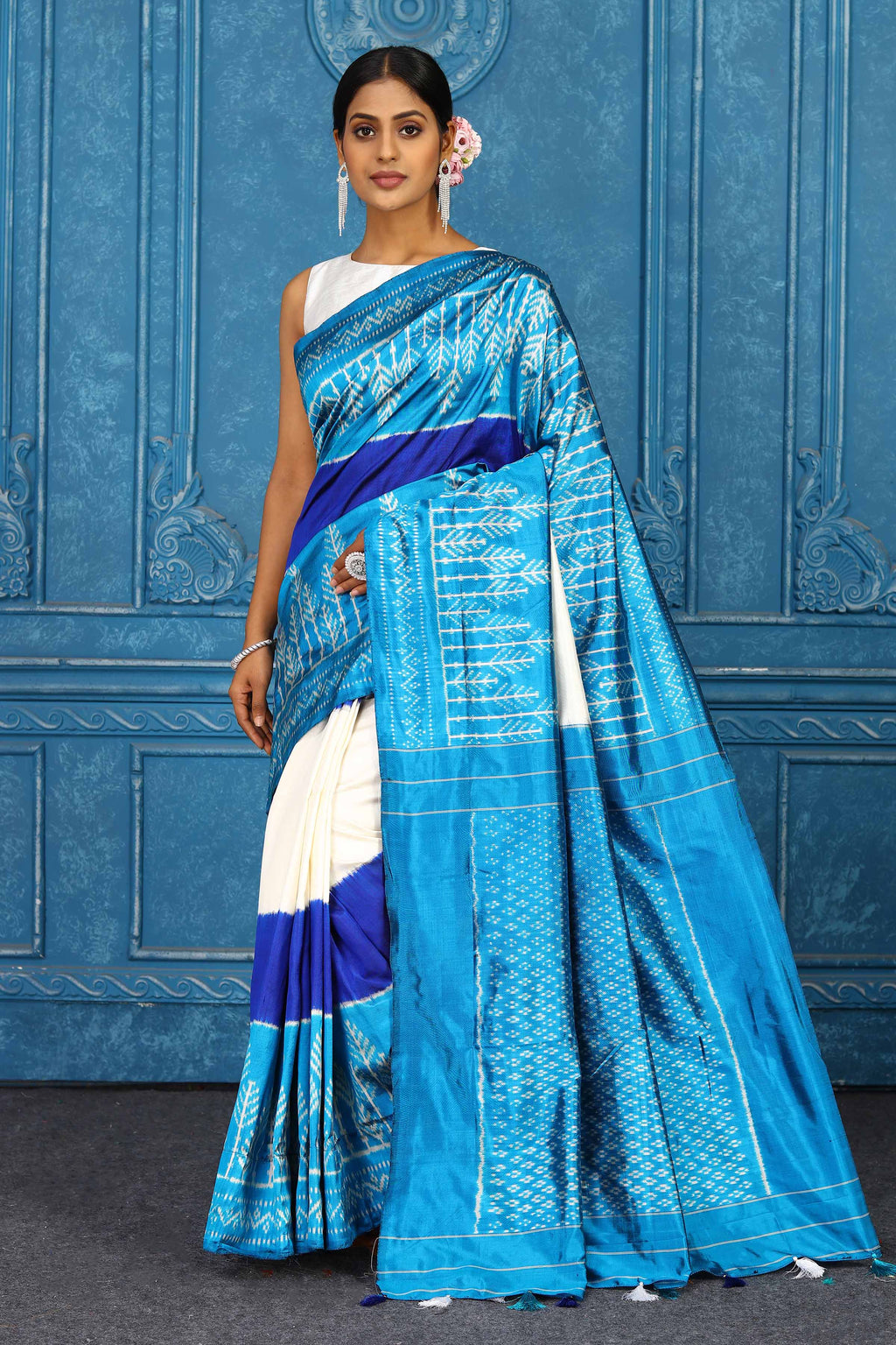 Shop cream and blue pochampally silk ikkat sari online in USA. Look your best on festive occasions in latest designer sarees, pure silk sarees, Kanchipuram sarees, handwoven sarees, tussar silk sarees, embroidered sarees from Pure Elegance Indian clothing store in USA.-full view
