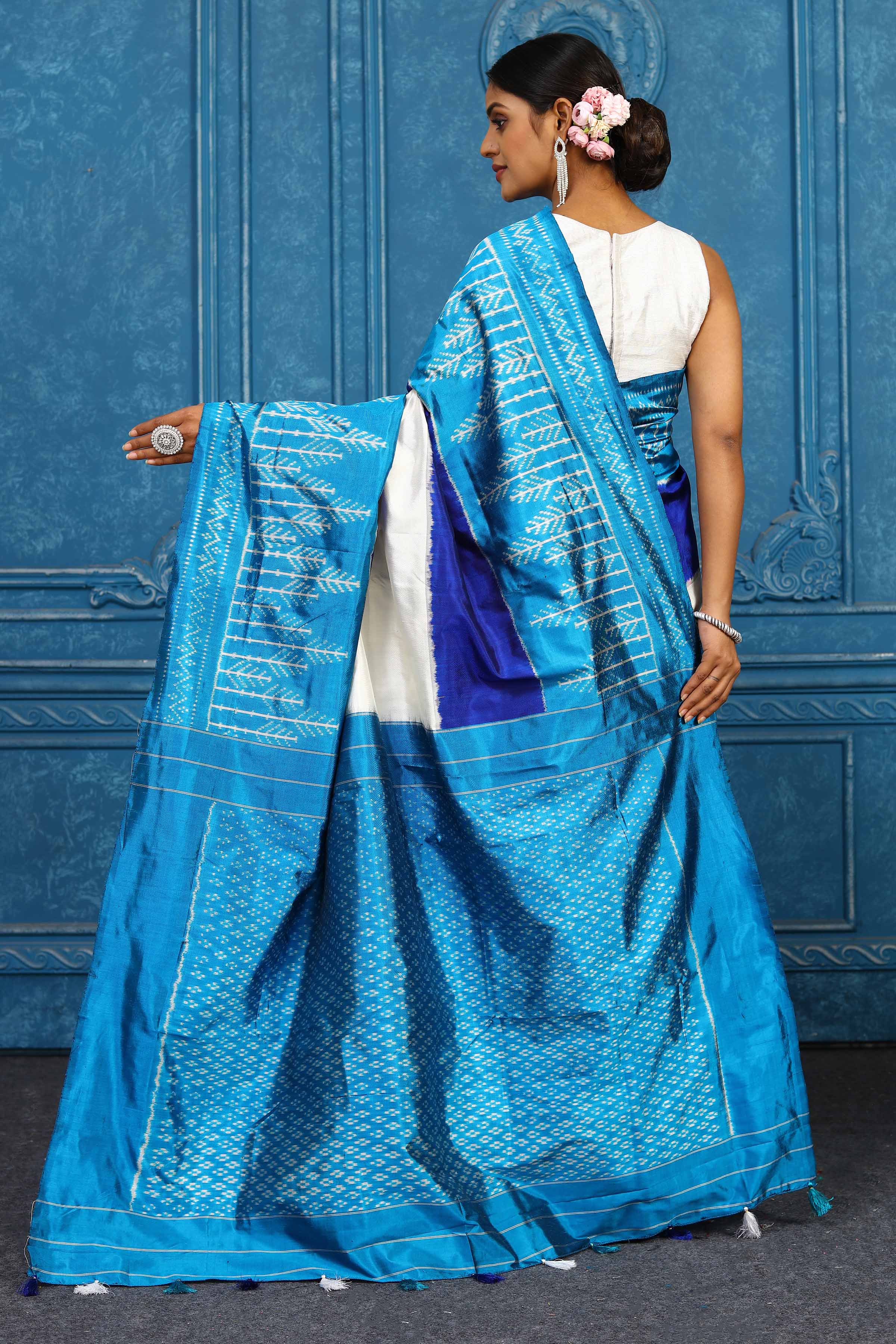 Shop cream and blue pochampally silk ikkat sari online in USA. Look your best on festive occasions in latest designer sarees, pure silk sarees, Kanchipuram sarees, handwoven sarees, tussar silk sarees, embroidered sarees from Pure Elegance Indian clothing store in USA.-back