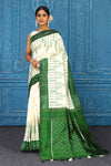 Buy cream pochampally silk ikkat sari online in USA with green border. Look your best on festive occasions in latest designer sarees, pure silk sarees, Kanchipuram sarees, handwoven sarees, tussar silk sarees, embroidered sarees from Pure Elegance Indian clothing store in USA.-full view