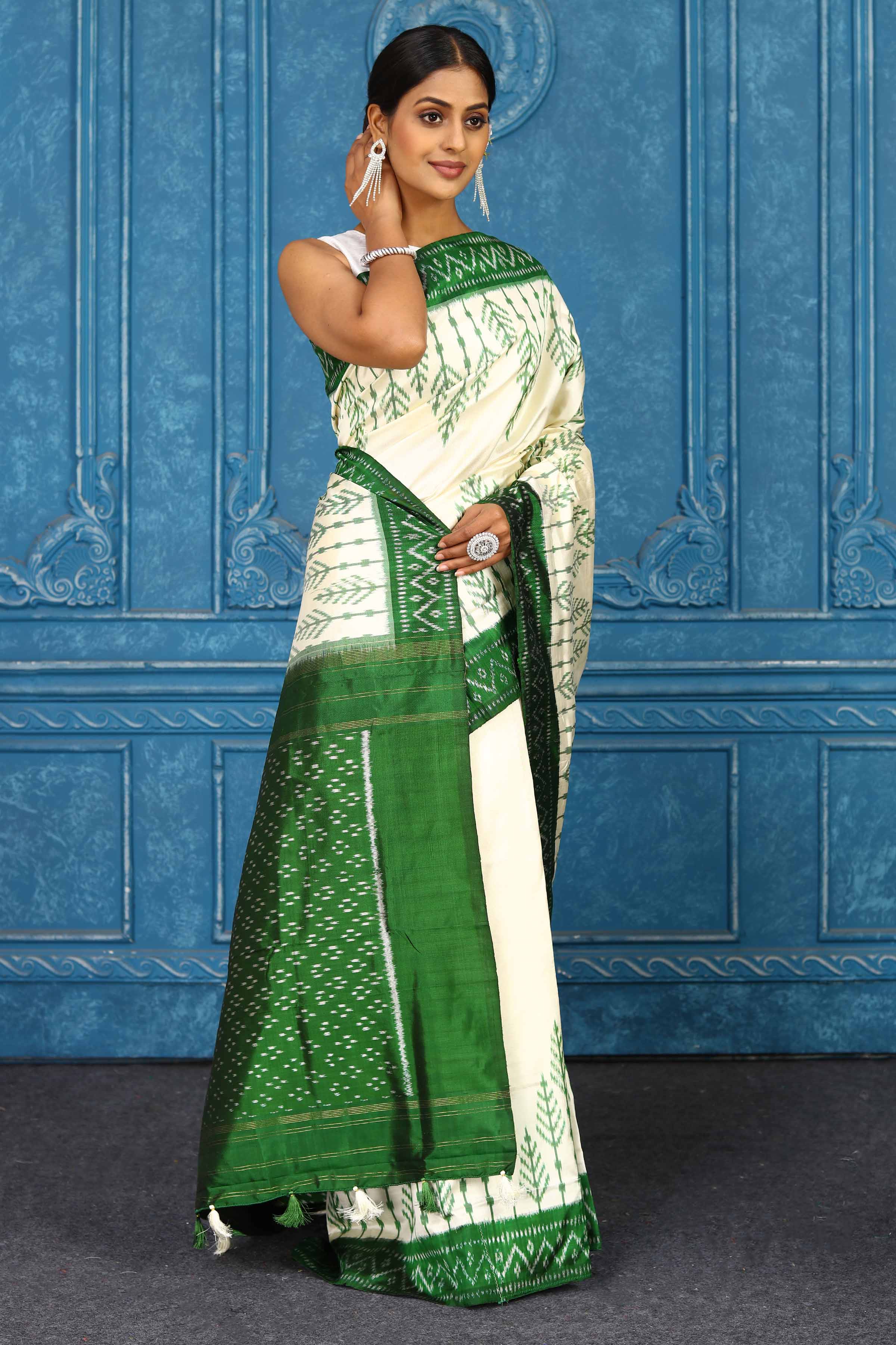 Buy cream pochampally silk ikkat sari online in USA with green border. Look your best on festive occasions in latest designer sarees, pure silk sarees, Kanchipuram sarees, handwoven sarees, tussar silk sarees, embroidered sarees from Pure Elegance Indian clothing store in USA.-side