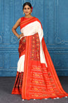 Shop beautiful cream and red pochampally silk ikkat saree online in USA. Look your best on festive occasions in latest designer sarees, pure silk sarees, Kanchipuram sarees, handwoven sarees, tussar silk sarees, embroidered sarees from Pure Elegance Indian clothing store in USA.-full view
