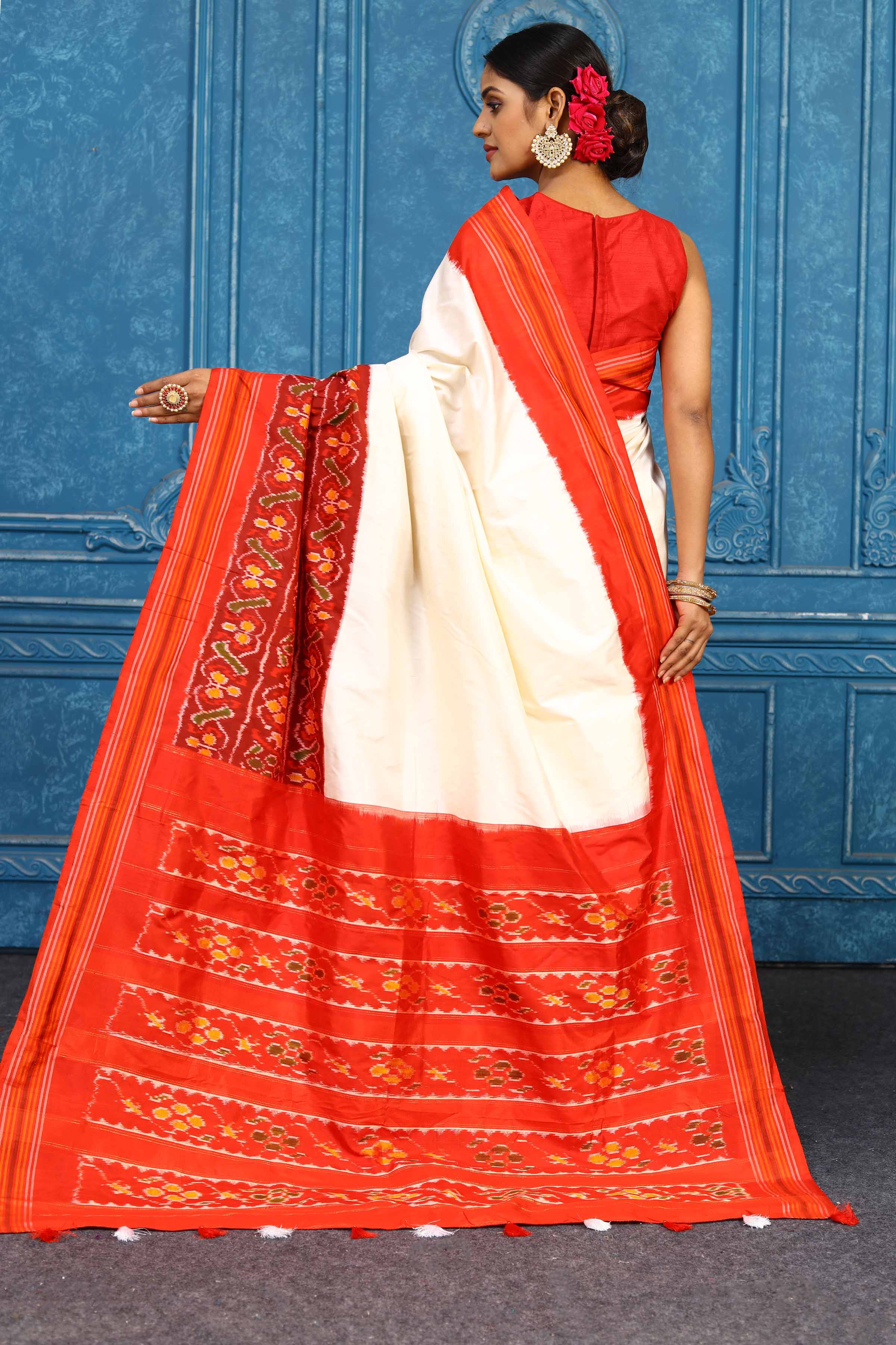 Shop beautiful cream and red pochampally silk ikkat saree online in USA. Look your best on festive occasions in latest designer sarees, pure silk sarees, Kanchipuram sarees, handwoven sarees, tussar silk sarees, embroidered sarees from Pure Elegance Indian clothing store in USA.-back