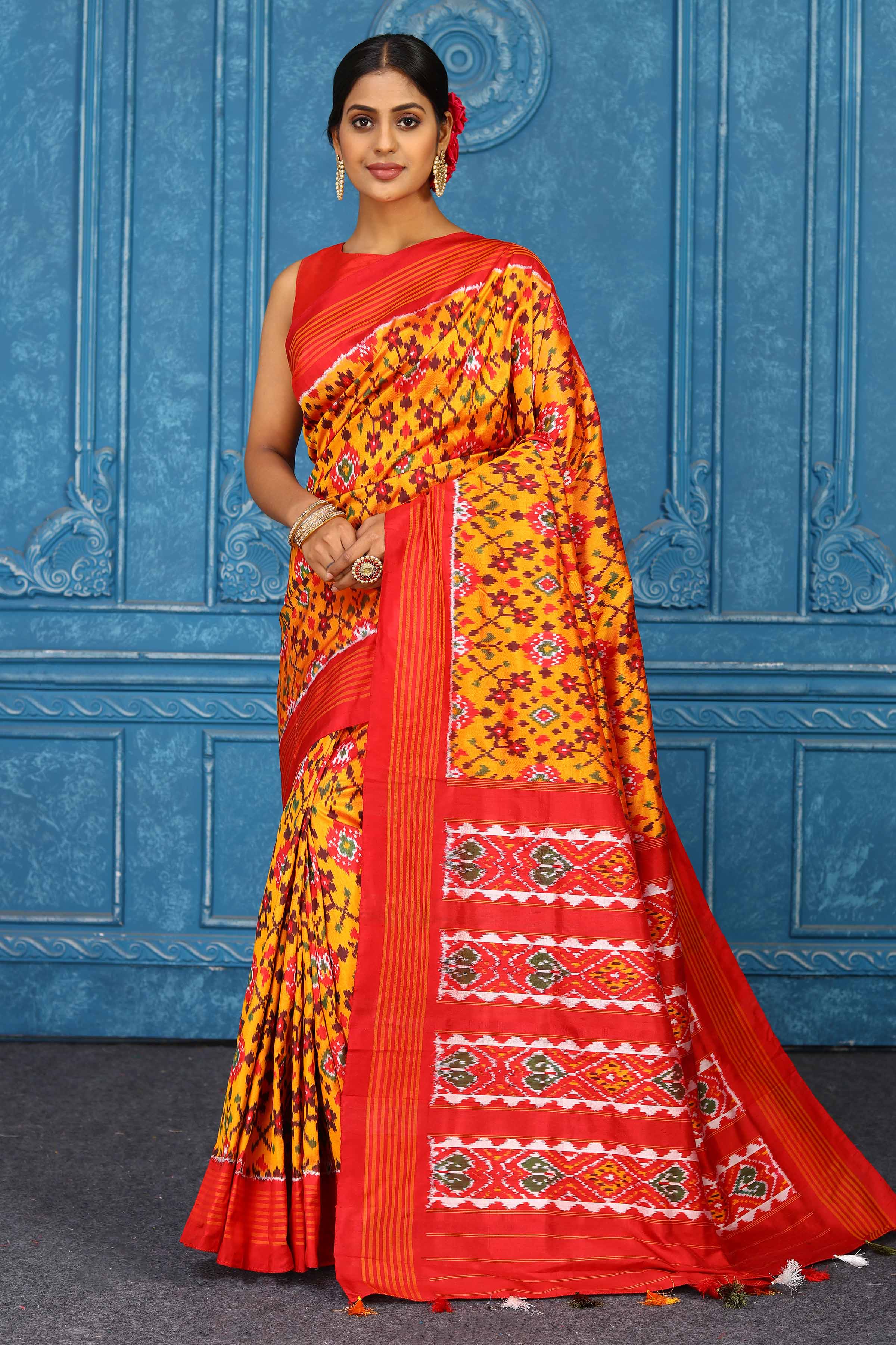 Shop beautiful mustard pochampally silk ikkat saree online in USA with orange striped border. Look your best on festive occasions in latest designer sarees, pure silk sarees, Kanchipuram sarees, handwoven sarees, tussar silk sarees, embroidered sarees from Pure Elegance Indian clothing store in USA.-full view