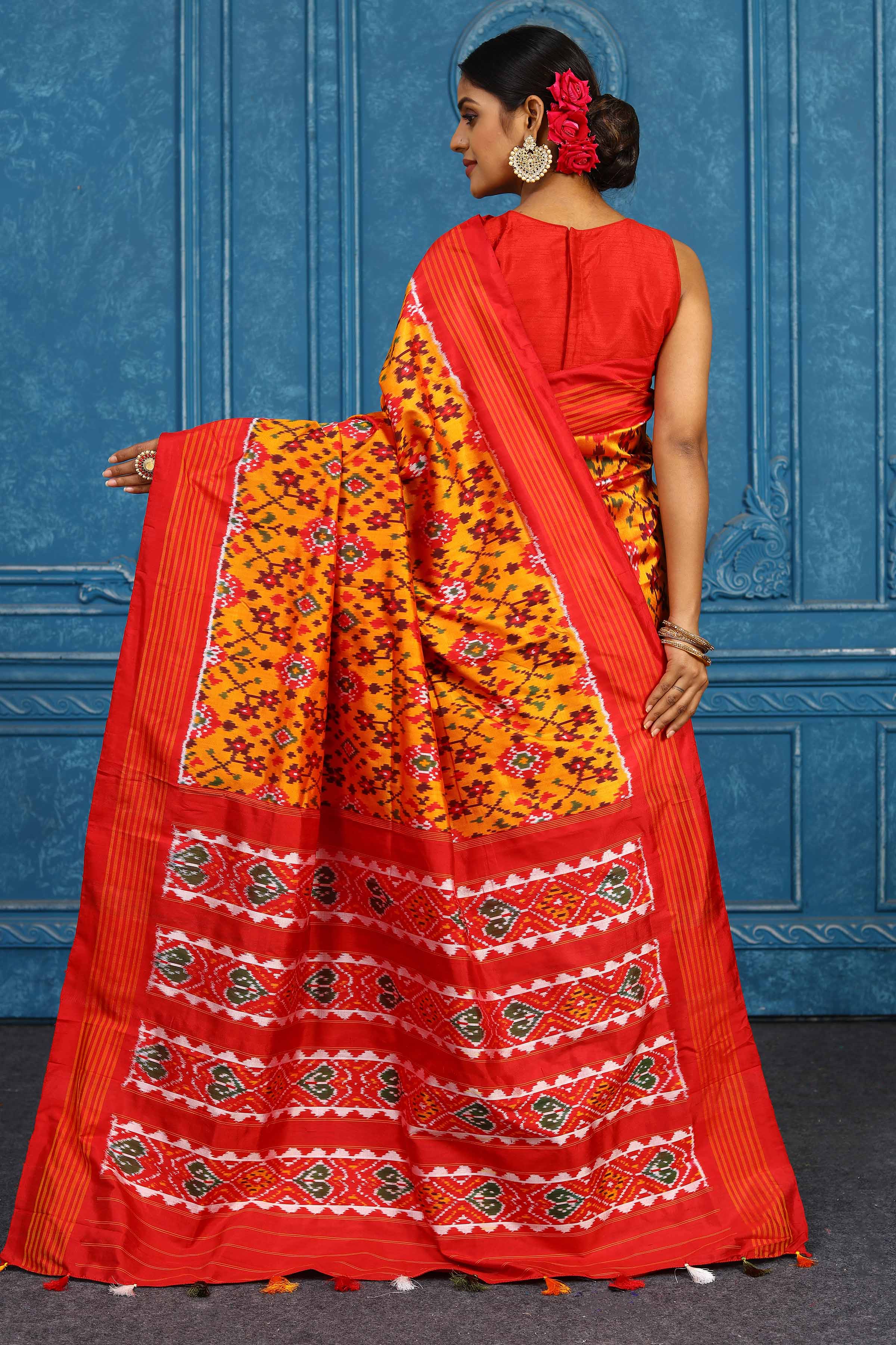 Shop beautiful mustard pochampally silk ikkat saree online in USA with orange striped border. Look your best on festive occasions in latest designer sarees, pure silk sarees, Kanchipuram sarees, handwoven sarees, tussar silk sarees, embroidered sarees from Pure Elegance Indian clothing store in USA.-back