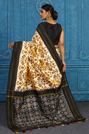 Shop cream pochampally silk ikkat saree online in USA with black border. Look your best on festive occasions in latest designer sarees, pure silk sarees, Kanchipuram sarees, handwoven sarees, tussar silk sarees, embroidered sarees from Pure Elegance Indian clothing store in USA.-back