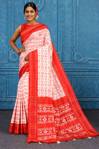 Shop beautiful cream pochampally silk ikkat saree online in USA with red border. Look your best on festive occasions in latest designer sarees, pure silk sarees, Kanchipuram sarees, handwoven sarees, tussar silk sarees, embroidered sarees from Pure Elegance Indian clothing store in USA.-pallu