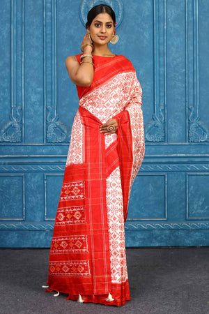 Shop beautiful cream pochampally silk ikkat saree online in USA with red border. Look your best on festive occasions in latest designer sarees, pure silk sarees, Kanchipuram sarees, handwoven sarees, tussar silk sarees, embroidered sarees from Pure Elegance Indian clothing store in USA.-side