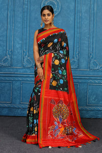 Shop black pochampally ikkat sari online in USA with red border. Look your best on festive occasions in latest designer sarees, pure silk sarees, Kanchipuram sarees, handwoven sarees, tussar silk sarees, embroidered sarees from Pure Elegance Indian clothing store in USA.-full view