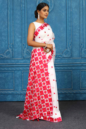 Shop beautiful white and red phulkari embroidery sari online in USA. Look your best on festive occasions in latest designer sarees, pure silk sarees, Kanchipuram sarees, handwoven sarees, tussar silk sarees, embroidered sarees from Pure Elegance Indian clothing store in USA.-side
