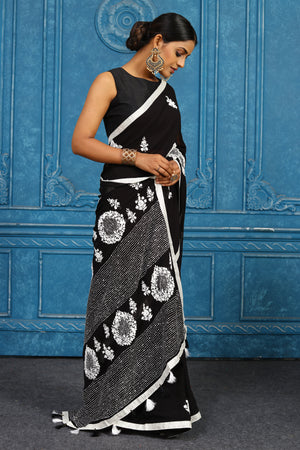 Shop black and white phulkari embroidery sari online in USA. Look your best on festive occasions in latest designer sarees, pure silk sarees, Kanchipuram sarees, handwoven sarees, tussar silk sarees, embroidered sarees from Pure Elegance Indian clothing store in USA.-side