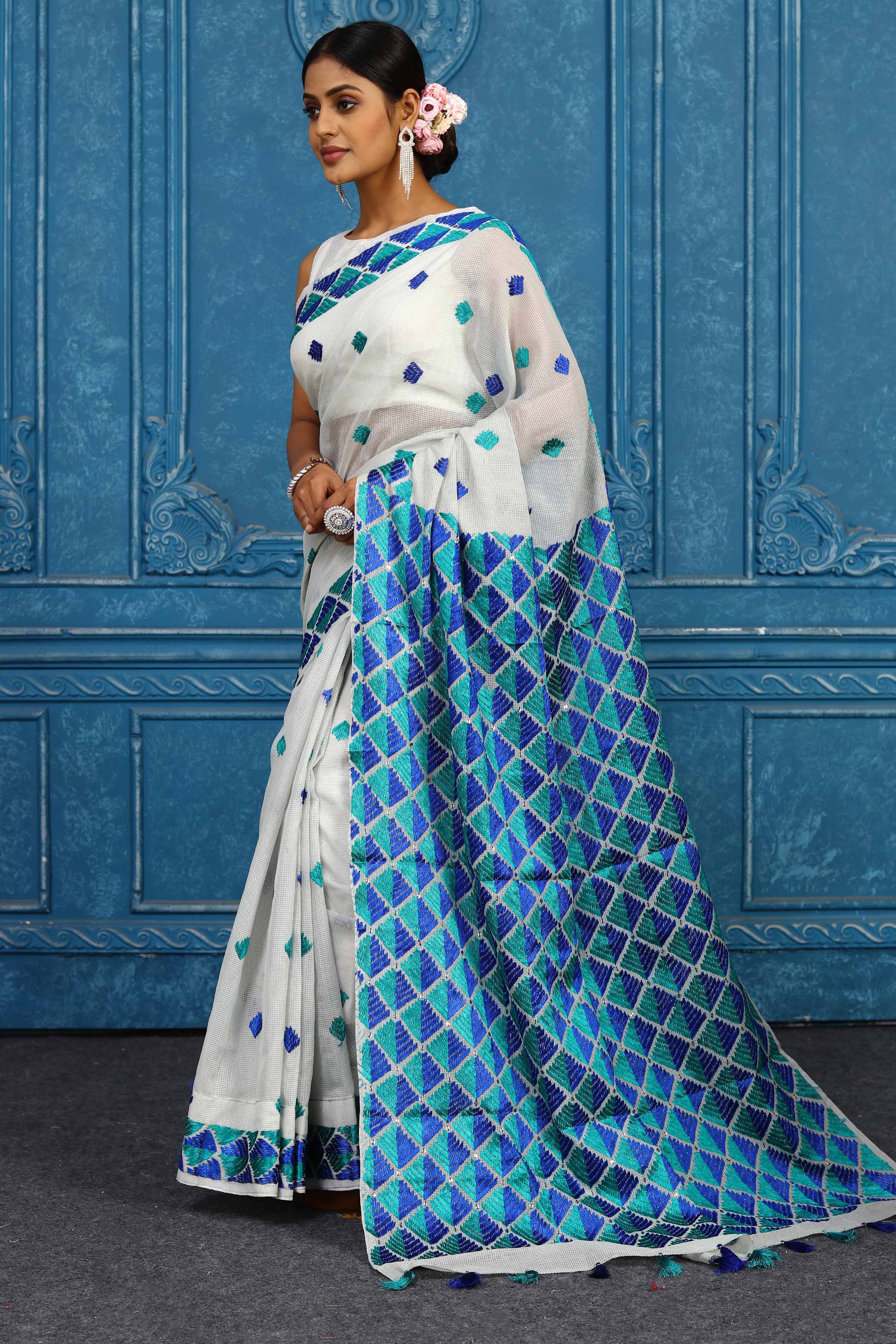 Buy elegant white phulkari embroidery sari online in USA. Look your best on festive occasions in latest designer sarees, pure silk sarees, Kanchipuram sarees, handwoven sarees, tussar silk sarees, embroidered sarees from Pure Elegance Indian clothing store in USA.-pallu