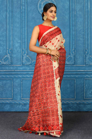Shop stunning cream phulkari embroidery sari online in USA. Look your best on festive occasions in latest designer sarees, pure silk sarees, Kanchipuram sarees, handwoven sarees, tussar silk sarees, embroidered sarees from Pure Elegance Indian clothing store in USA.-side