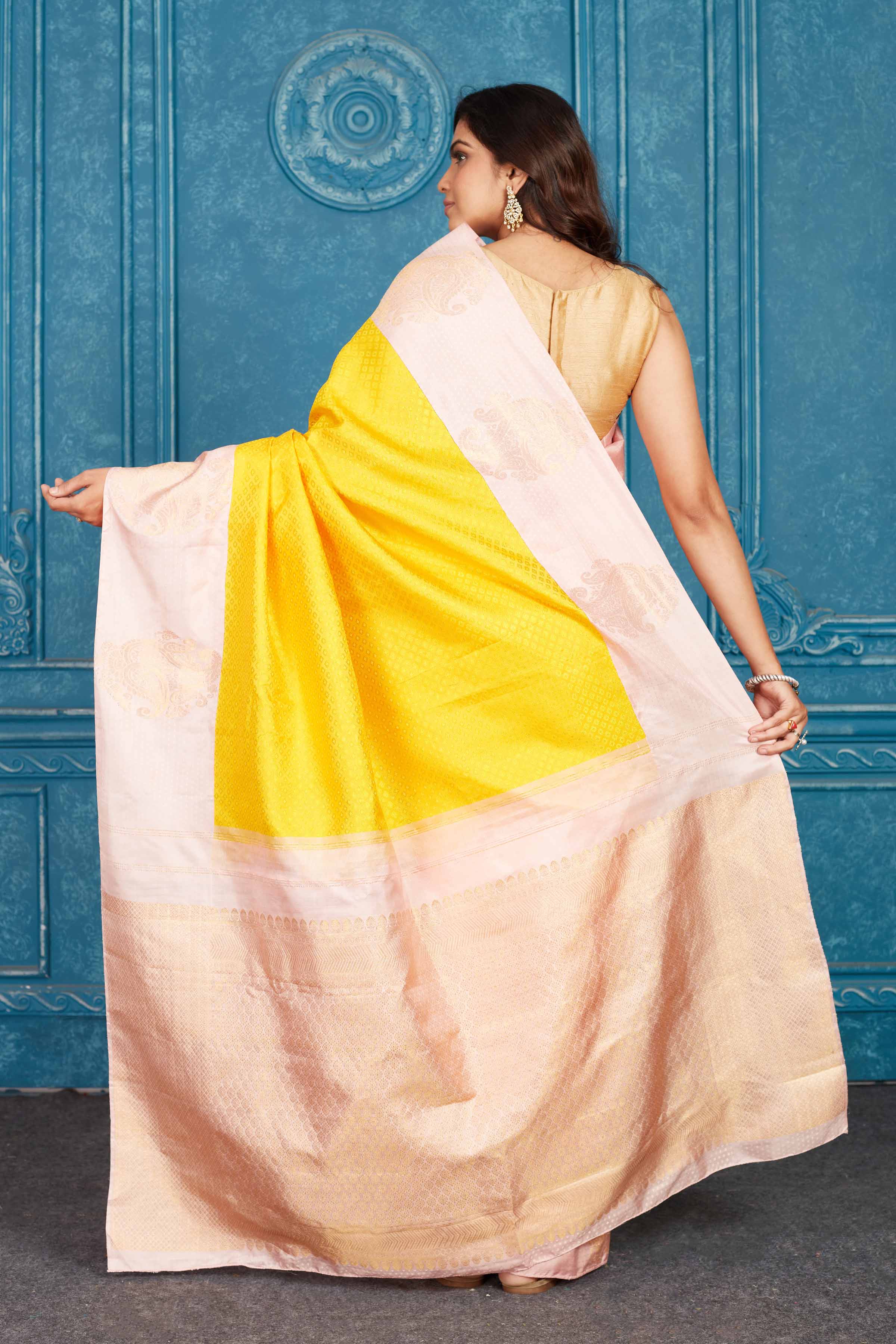 Shop yellow and powder pink Kanchipuram silk saree online in USA. Level up your ethnic style in latest designer saris, pure silk saris, Kanchipuram silk saris, handwoven sarees, tussar silk sarees, embroidered saris from Pure Elegance Indian clothing store in USA.-back