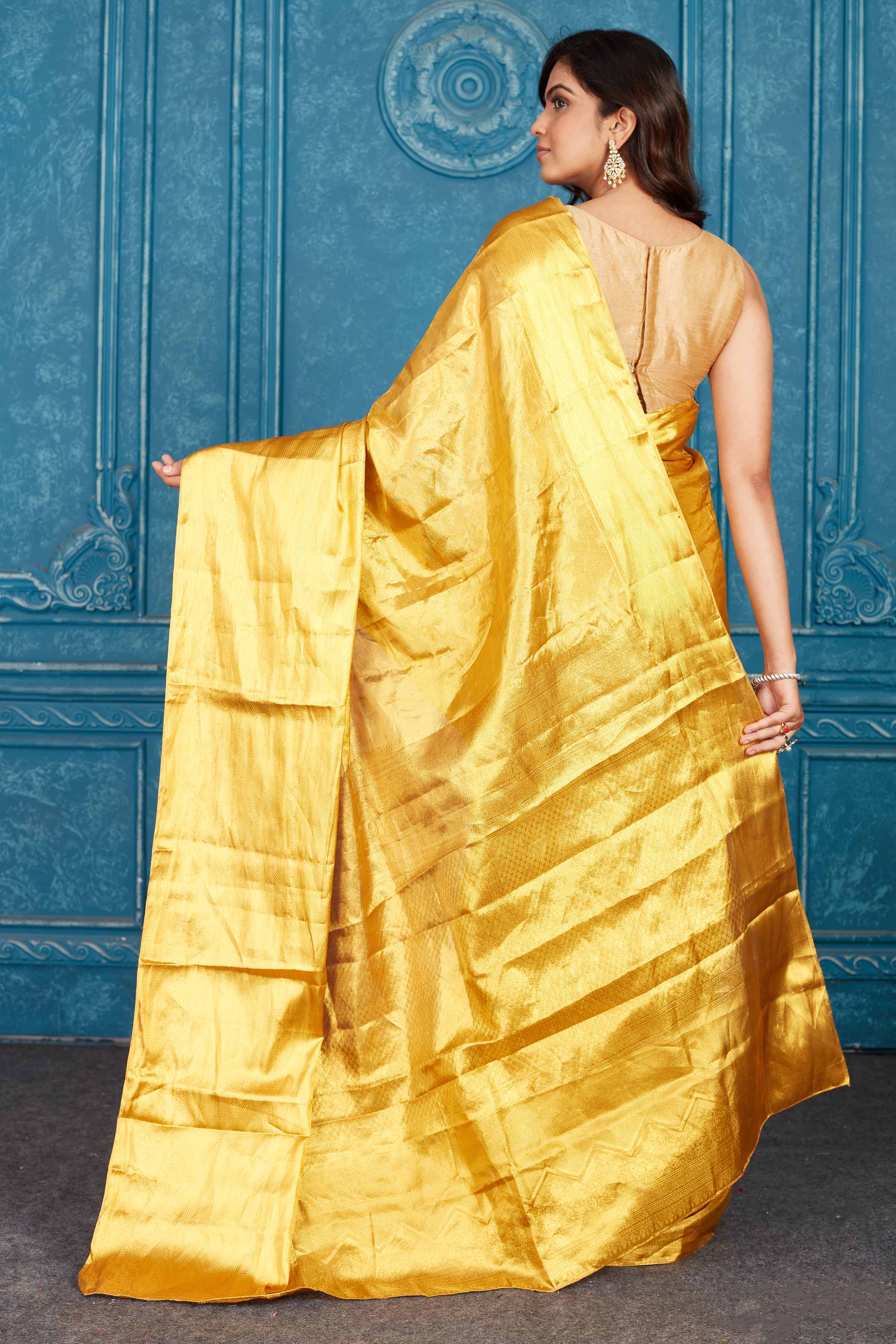 Buy stunning golden heavy Kanchipuram silk saree online in USA. Level up your ethnic style in latest designer saris, pure silk saris, Kanchipuram silk saris, handwoven sarees, tussar silk sarees, embroidered saris from Pure Elegance Indian clothing store in USA.-back
