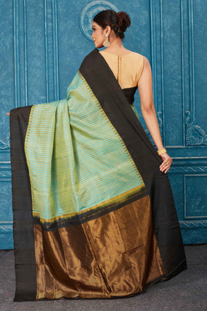 Shop stunning pista green Kanchipuram silk saree online in USA with black border. Radiate glam at parties in dazzling designer sarees, party sarees, embroidered sarees, sequin work sarees, Bollywood sarees, handloom sarees from Pure Elegance Indian saree store in USA.-back