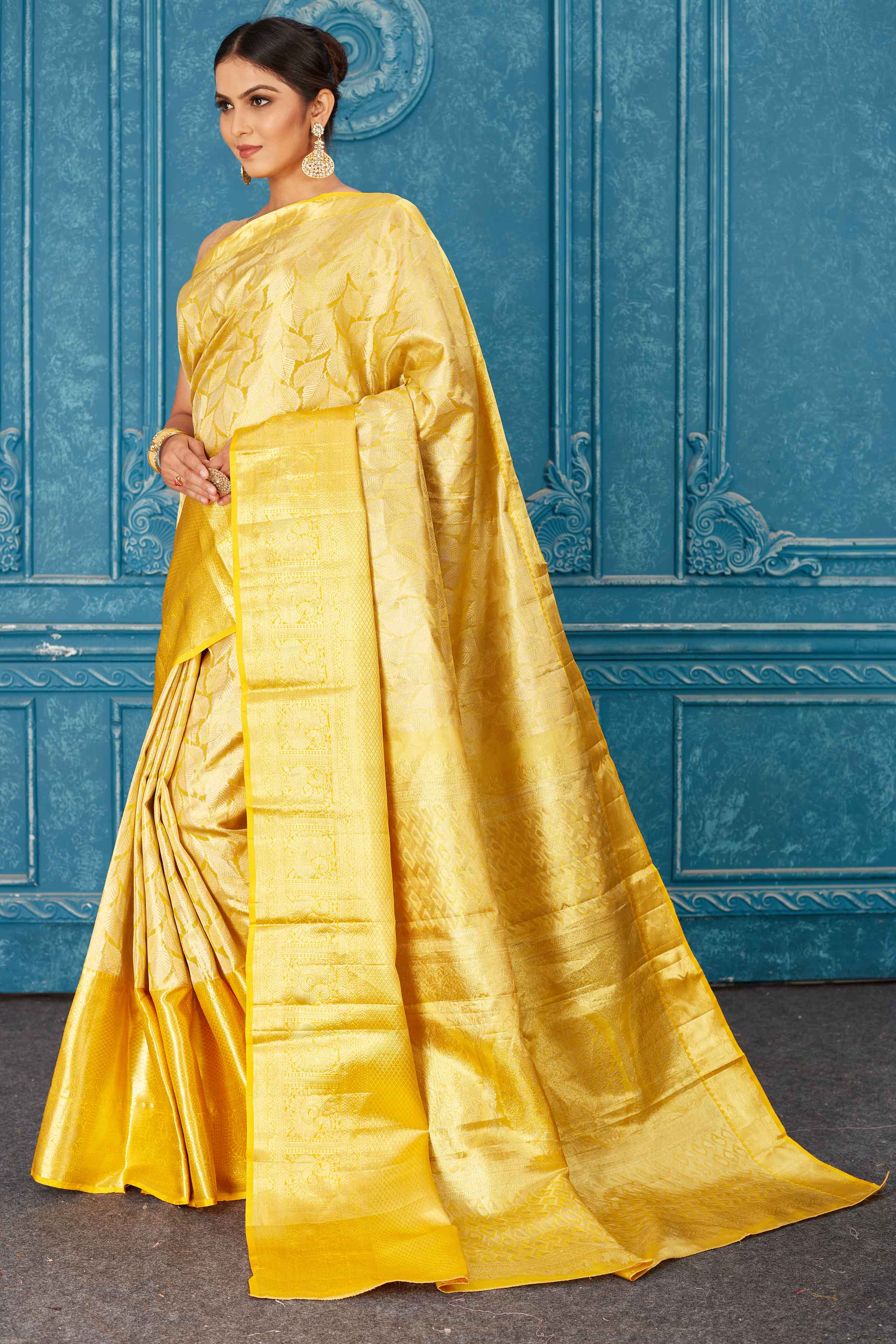 Shop beautiful golden Kanjeevaram silk saree online in USA with overall zari work. Radiate glam at parties in dazzling designer sarees, party sarees, embroidered sarees, sequin work sarees, Bollywood sarees, handloom sarees from Pure Elegance Indian saree store in USA.-pallu