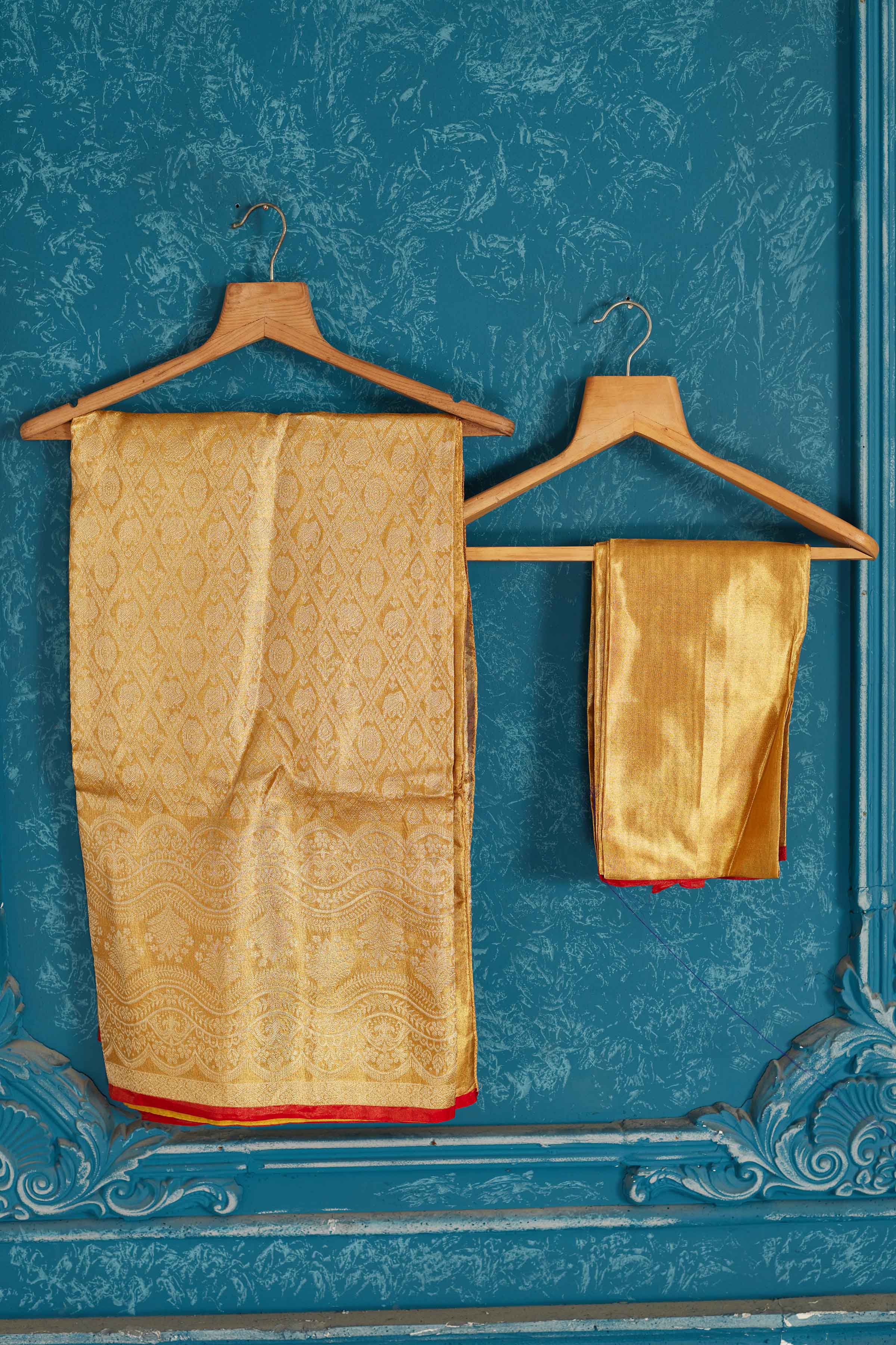 Buy beautiful golden Kanjeevaram silk sari online in USA with red edging. Radiate glam at parties in dazzling designer sarees, party sarees, embroidered sarees, sequin work sarees, Bollywood sarees, handloom sarees from Pure Elegance Indian saree store in USA.-blouse