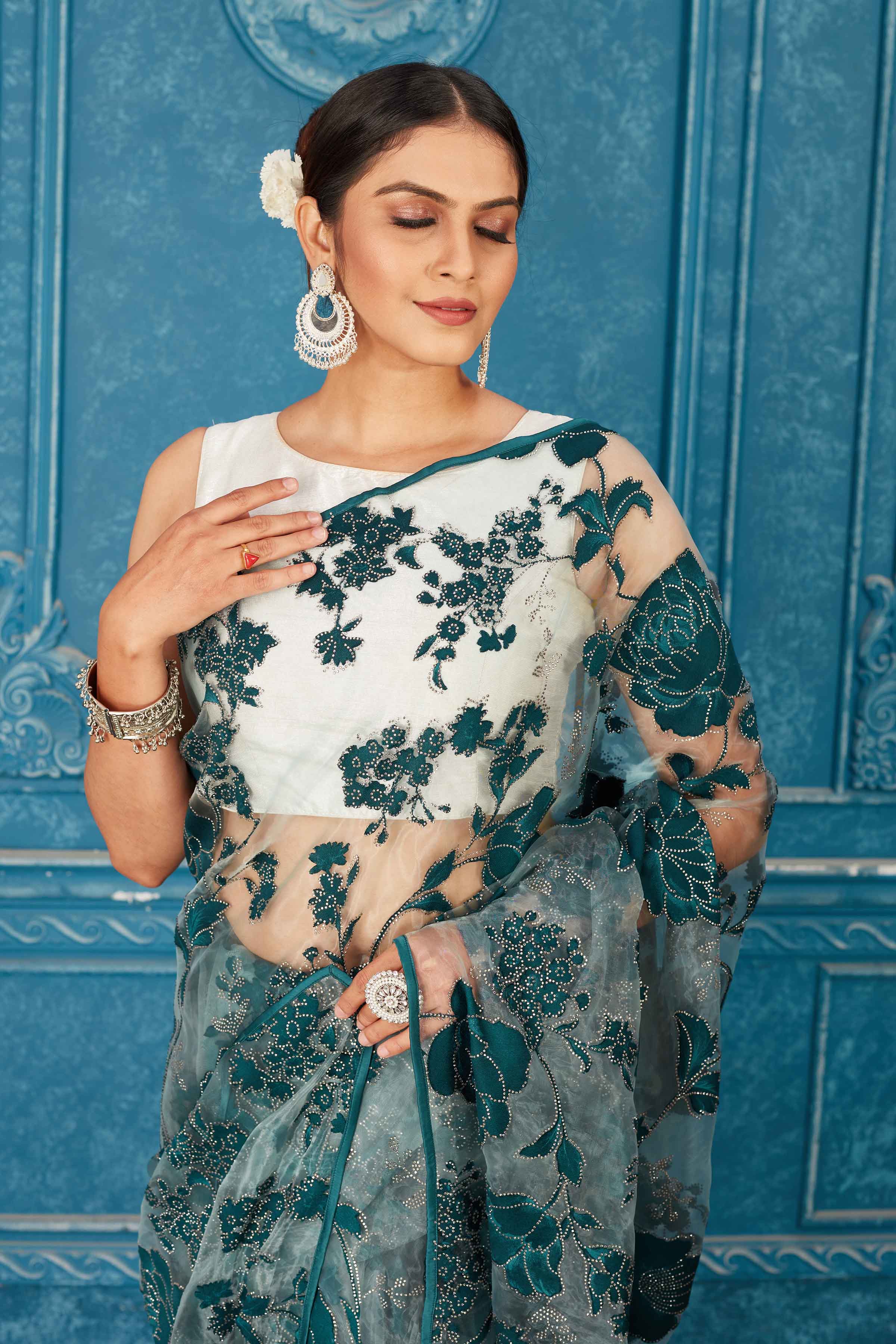 Buy beautiful sea green tissue silk saree online in USA with embrose and stone work. Radiate glam at parties in dazzling designer sarees, party sarees, embroidered sarees, sequin work sarees, Bollywood sarees, handloom sarees from Pure Elegance Indian saree store in USA.-closeup