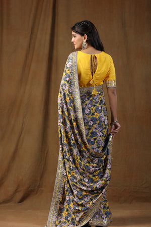Buy yellow and grey floral print crepe sari online in USA with embroidered border. Make a fashion statement on festive occasions and weddings with designer suits, Indian dresses, Anarkali suits, palazzo suits, designer sarees, sharara suits, Bollywood saris from Pure Elegance Indian fashion store in USA.-back