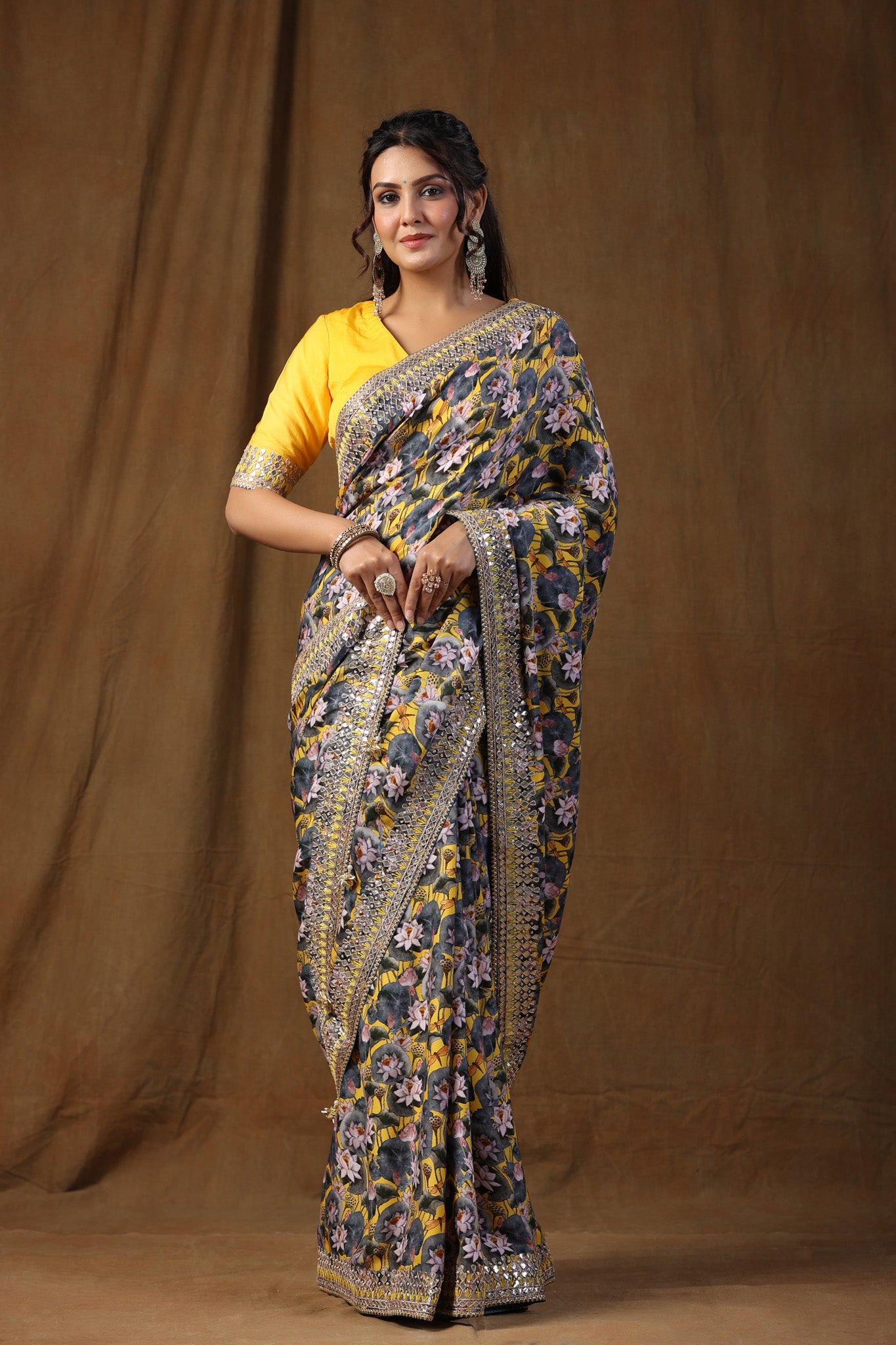 Buy yellow and grey floral print crepe sari online in USA with embroidered border. Make a fashion statement on festive occasions and weddings with designer suits, Indian dresses, Anarkali suits, palazzo suits, designer sarees, sharara suits, Bollywood saris from Pure Elegance Indian fashion store in USA.-saree