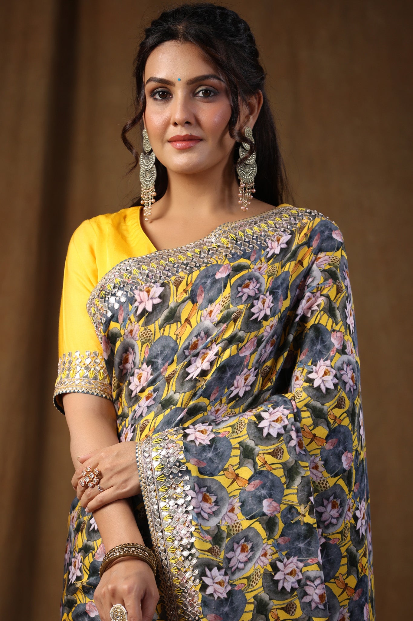 Buy yellow and grey floral print crepe sari online in USA with embroidered border. Make a fashion statement on festive occasions and weddings with designer suits, Indian dresses, Anarkali suits, palazzo suits, designer sarees, sharara suits, Bollywood saris from Pure Elegance Indian fashion store in USA.-closeup