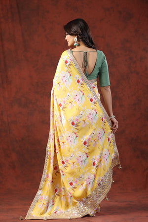 Shop yellow floral print crepe sari online in USA with embroidered border. Make a fashion statement on festive occasions and weddings with designer suits, Indian dresses, Anarkali suits, palazzo suits, designer sarees, sharara suits, Bollywood saris from Pure Elegance Indian fashion store in USA.-back