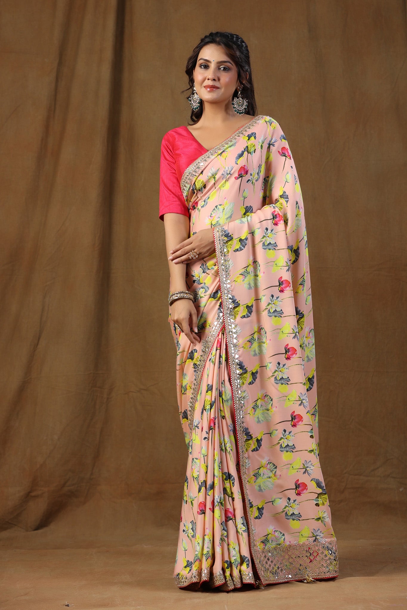 Buy stunning peach floral print crepe sari online in USA with embroidered border. Make a fashion statement on festive occasions and weddings with designer suits, Indian dresses, Anarkali suits, palazzo suits, designer sarees, sharara suits, Bollywood saris from Pure Elegance Indian fashion store in USA.-front