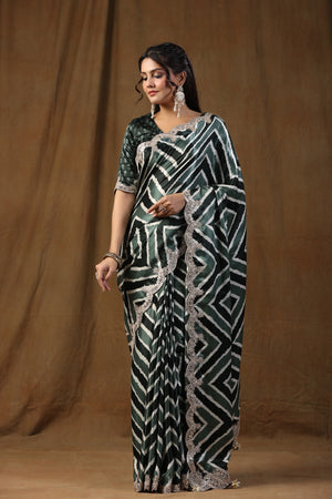 Buy grey and black embroidered tussar silk sari online in USA with blouse. Make a fashion statement on festive occasions and weddings with designer suits, Indian dresses, Anarkali suits, palazzo suits, designer sarees, sharara suits, Bollywood saris from Pure Elegance Indian fashion store in USA.-saree