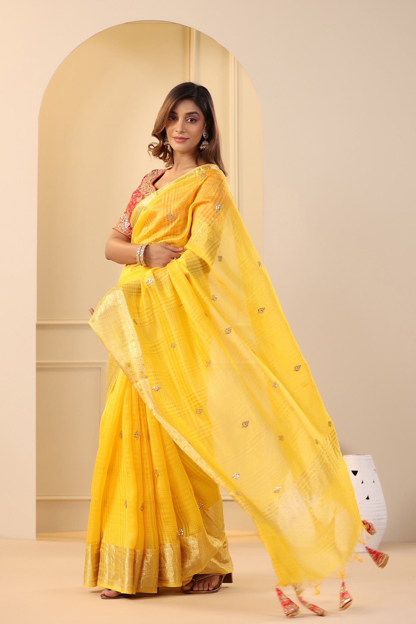 Shop yellow silk organza sari online in USA with red embroidered blouse. Make a fashion statement on festive occasions and weddings with designer suits, Indian dresses, Anarkali suits, palazzo suits, designer sarees, sharara suits, Bollywood saris from Pure Elegance Indian fashion store in USA.-pallu