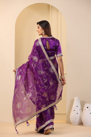 Buy beautiful purple embroidered organza sari online in USA with embroidered blouse. Make a fashion statement on festive occasions and weddings with designer suits, Indian dresses, Anarkali suits, palazzo suits, designer sarees, sharara suits, Bollywood saris from Pure Elegance Indian fashion store in USA.-back