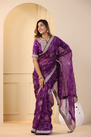 Buy beautiful purple embroidered organza sari online in USA with embroidered blouse. Make a fashion statement on festive occasions and weddings with designer suits, Indian dresses, Anarkali suits, palazzo suits, designer sarees, sharara suits, Bollywood saris from Pure Elegance Indian fashion store in USA.-front