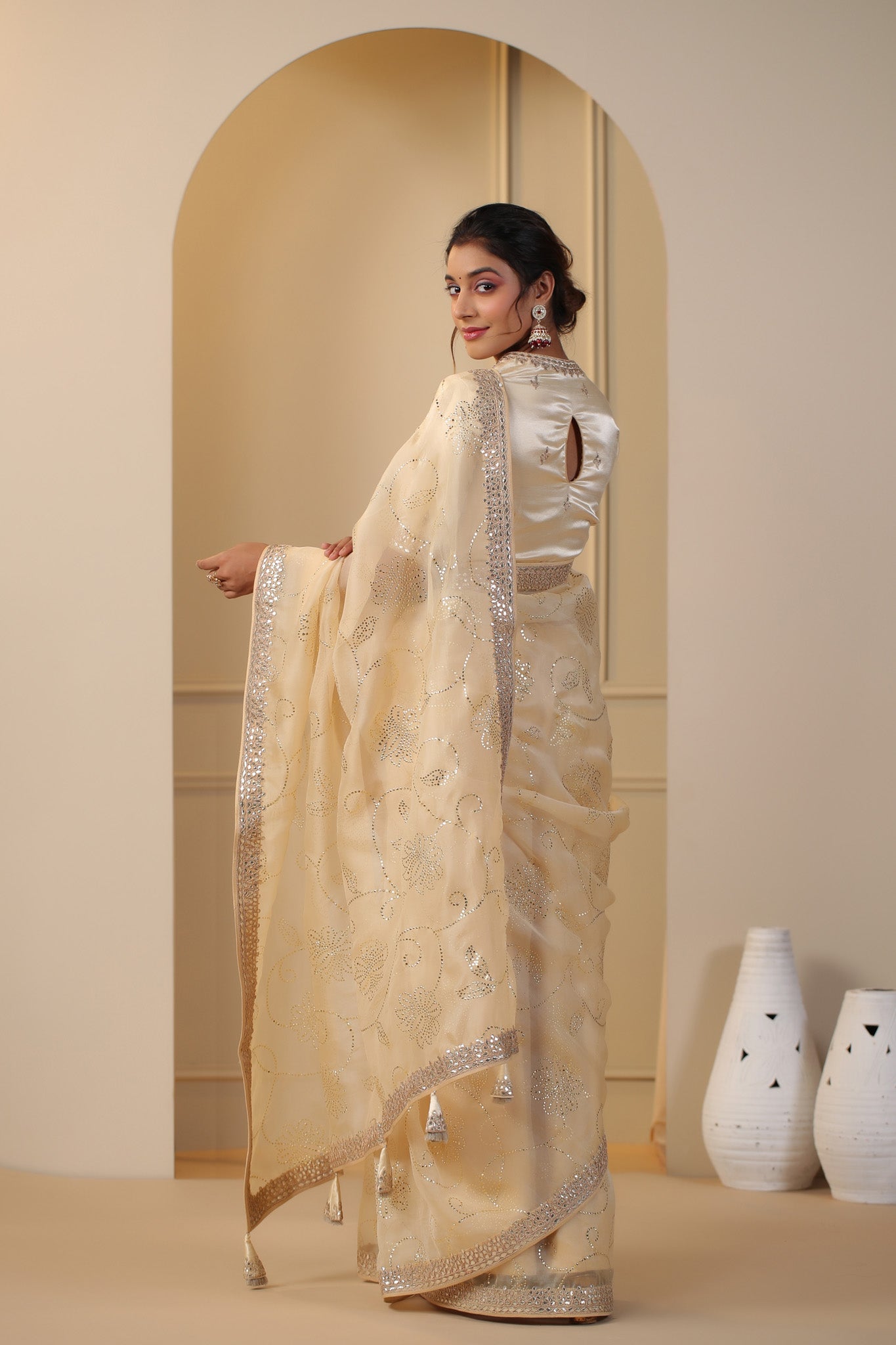 Shop beautiful cream embroidered organza sari online in USA with embroidered blouse. Make a fashion statement on festive occasions and weddings with designer suits, Indian dresses, Anarkali suits, palazzo suits, designer sarees, sharara suits, Bollywood saris from Pure Elegance Indian fashion store in USA.-back