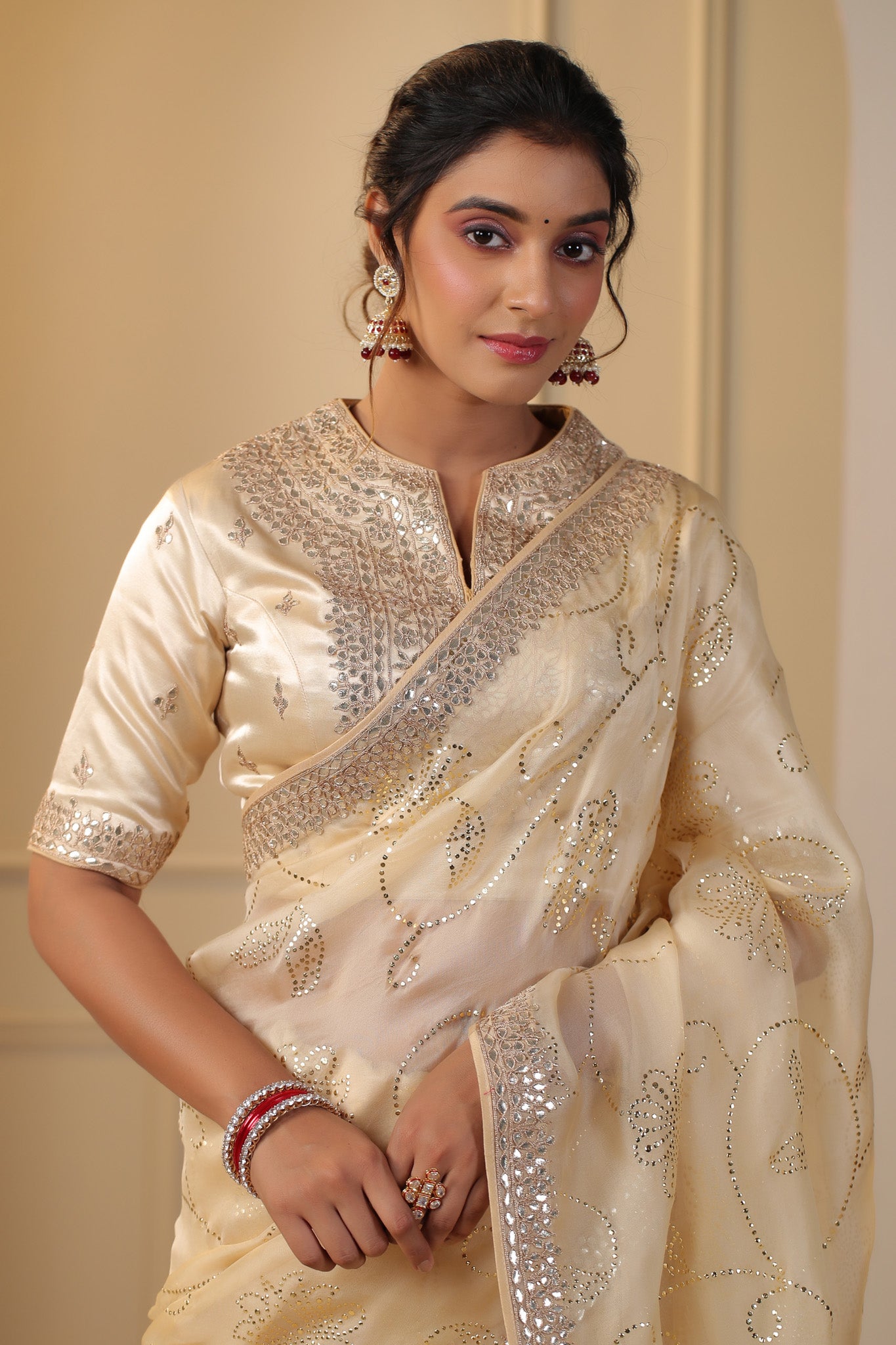 Shop beautiful cream embroidered organza sari online in USA with embroidered blouse. Make a fashion statement on festive occasions and weddings with designer suits, Indian dresses, Anarkali suits, palazzo suits, designer sarees, sharara suits, Bollywood saris from Pure Elegance Indian fashion store in USA.-closeup