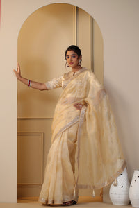 Shop beautiful cream embroidered organza sari online in USA with embroidered blouse. Make a fashion statement on festive occasions and weddings with designer suits, Indian dresses, Anarkali suits, palazzo suits, designer sarees, sharara suits, Bollywood saris from Pure Elegance Indian fashion store in USA.-full view