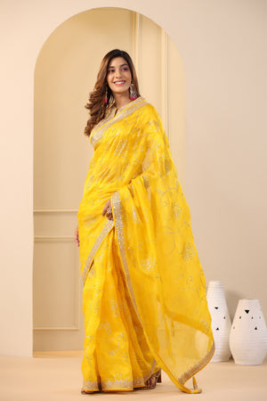 Buy beautiful mango yellow embroidered organza sari online in USA with embroidered blouse. Make a fashion statement on festive occasions and weddings with designer suits, Indian dresses, Anarkali suits, palazzo suits, designer sarees, sharara suits, Bollywood saris from Pure Elegance Indian fashion store in USA.-pallu