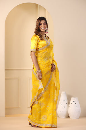 Buy beautiful mango yellow embroidered organza sari online in USA with embroidered blouse. Make a fashion statement on festive occasions and weddings with designer suits, Indian dresses, Anarkali suits, palazzo suits, designer sarees, sharara suits, Bollywood saris from Pure Elegance Indian fashion store in USA.-side