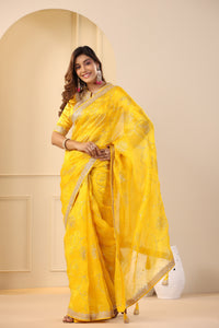 Buy beautiful mango yellow embroidered organza sari online in USA with embroidered blouse. Make a fashion statement on festive occasions and weddings with designer suits, Indian dresses, Anarkali suits, palazzo suits, designer sarees, sharara suits, Bollywood saris from Pure Elegance Indian fashion store in USA.-full view