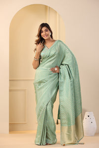 Shop stunning pastel green silk sari online in USA with embroidered sari blouse. Make a fashion statement on festive occasions and weddings with designer suits, Indian dresses, Anarkali suits, palazzo suits, designer sarees, sharara suits, Bollywood saris from Pure Elegance Indian fashion store in USA.-full view