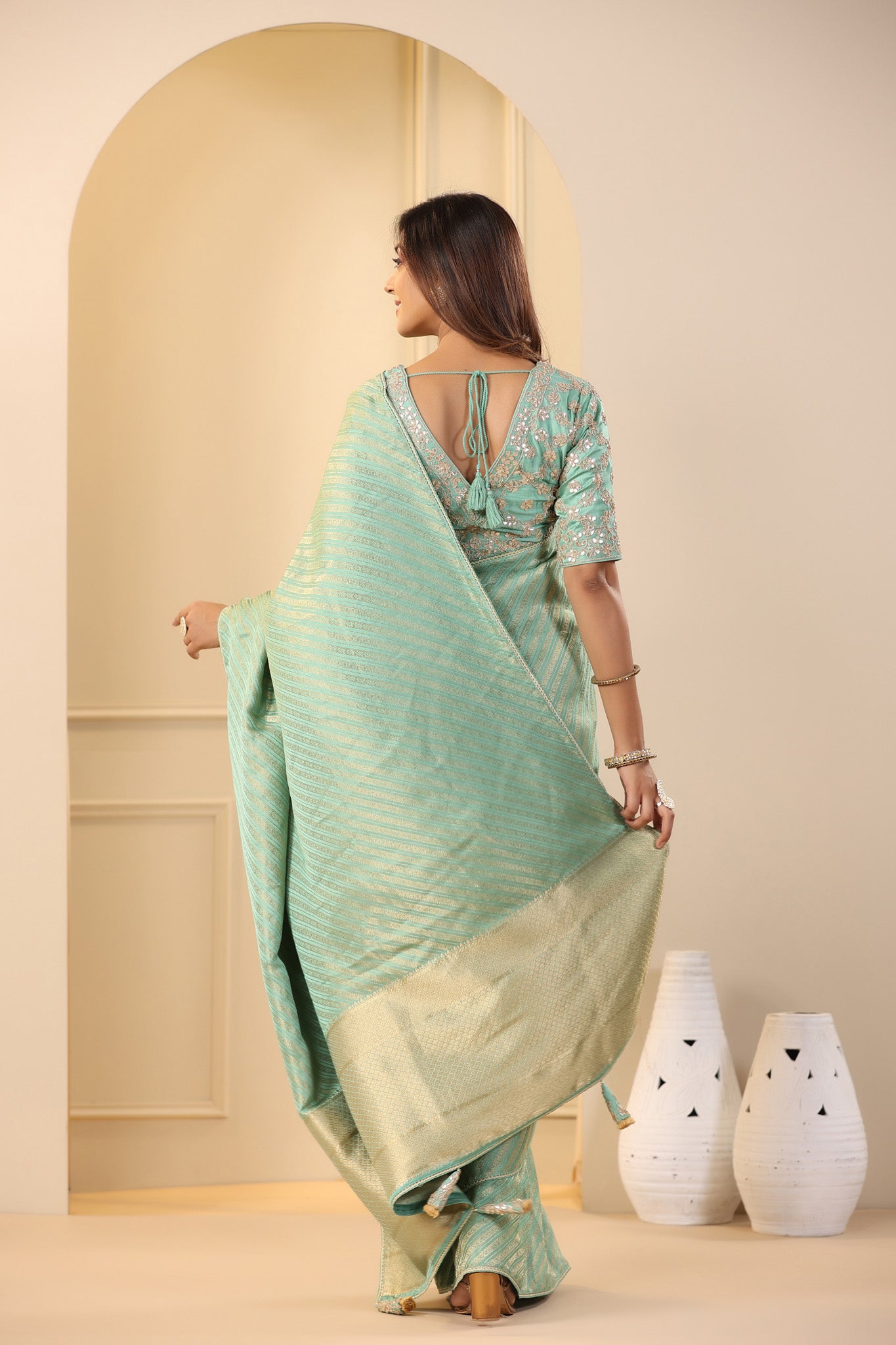 Shop stunning pastel green silk sari online in USA with embroidered sari blouse. Make a fashion statement on festive occasions and weddings with designer suits, Indian dresses, Anarkali suits, palazzo suits, designer sarees, sharara suits, Bollywood saris from Pure Elegance Indian fashion store in USA.-back