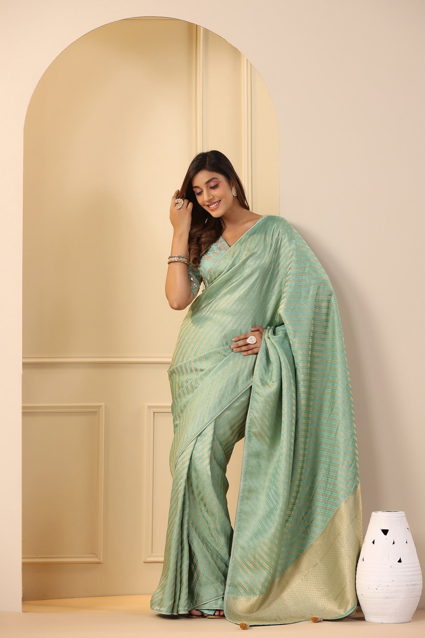Shop stunning pastel green silk sari online in USA with embroidered sari blouse. Make a fashion statement on festive occasions and weddings with designer suits, Indian dresses, Anarkali suits, palazzo suits, designer sarees, sharara suits, Bollywood saris from Pure Elegance Indian fashion store in USA.-pallu