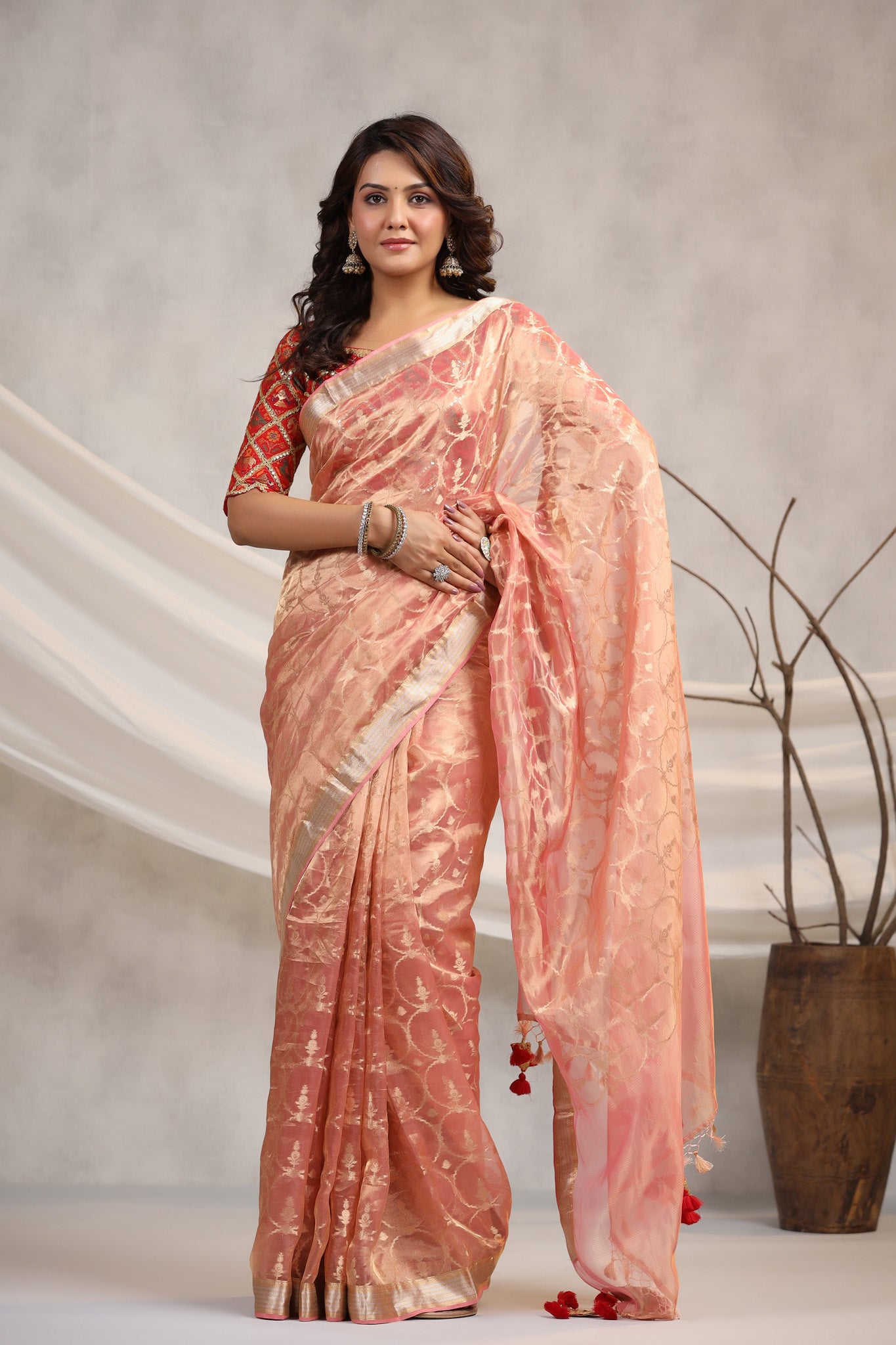 Shop light pink silk organza sari online in USA with red saree blouse. Make a fashion statement on festive occasions and weddings with designer suits, Indian dresses, Anarkali suits, palazzo suits, designer sarees, sharara suits, Bollywood saris from Pure Elegance Indian fashion store in USA.-front