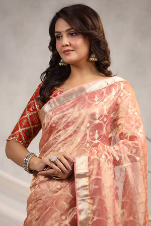 Shop light pink silk organza sari online in USA with red saree blouse. Make a fashion statement on festive occasions and weddings with designer suits, Indian dresses, Anarkali suits, palazzo suits, designer sarees, sharara suits, Bollywood saris from Pure Elegance Indian fashion store in USA.-closeup