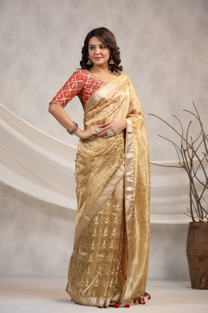 Shop golden silk organza sari online in USA with red saree blouse. Make a fashion statement on festive occasions and weddings with designer suits, Indian dresses, Anarkali suits, palazzo suits, designer sarees, sharara suits, Bollywood saris from Pure Elegance Indian fashion store in USA.-front
