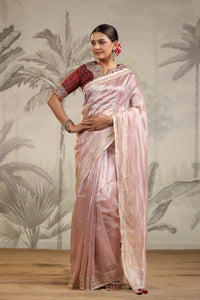 Buy powder pink tissue silk sari online in USA with embroidered blouse. Make a fashion statement on festive occasions and weddings with designer suits, Indian dresses, Anarkali suits, palazzo suits, designer sarees, sharara suits, Bollywood saris from Pure Elegance Indian fashion store in USA.-full view