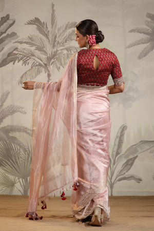 Buy powder pink tissue silk sari online in USA with embroidered blouse. Make a fashion statement on festive occasions and weddings with designer suits, Indian dresses, Anarkali suits, palazzo suits, designer sarees, sharara suits, Bollywood saris from Pure Elegance Indian fashion store in USA.-back