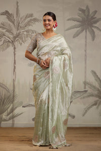 Shop pista green tissue silk sari online in USA with embroidered blouse. Make a fashion statement on festive occasions and weddings with designer suits, Indian dresses, Anarkali suits, palazzo suits, designer sarees, sharara suits, Bollywood saris from Pure Elegance Indian fashion store in USA.-full view